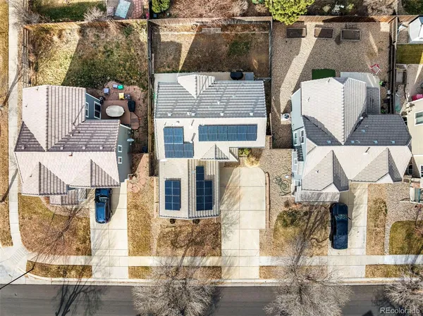 an aerial view of residential houses with outdoor space