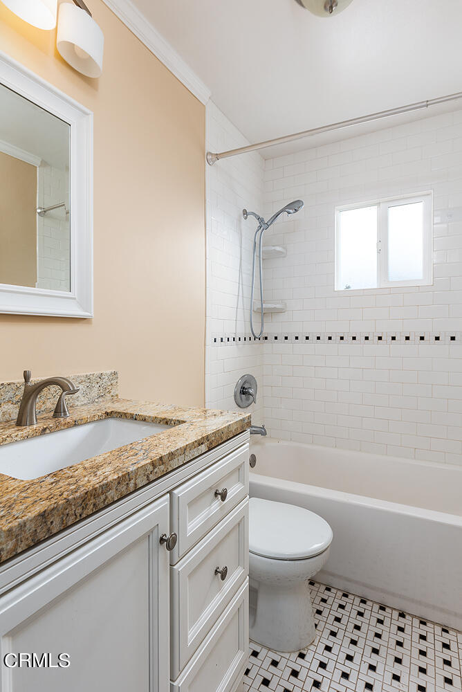 159-161 May Avenue Monrovia, CA 91016 - Photo 12 of 33 a bathroom with a granite countertop sink a toilet and bathtub