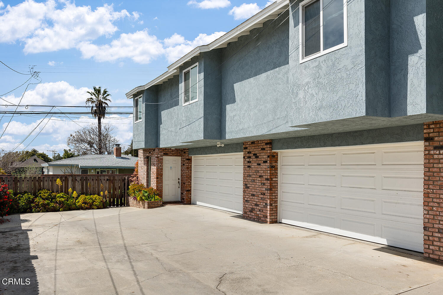159-161 May Avenue Monrovia, CA 91016 - Photo 16 of 33 a front view of a house with a yard and garage