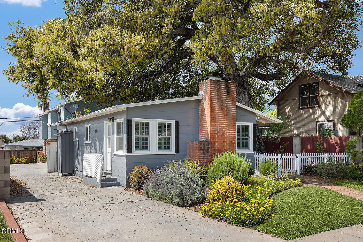 159-161 May Avenue Monrovia, CA 91016 - Photo 2 of 33 a front view of a house with a yard and potted plants