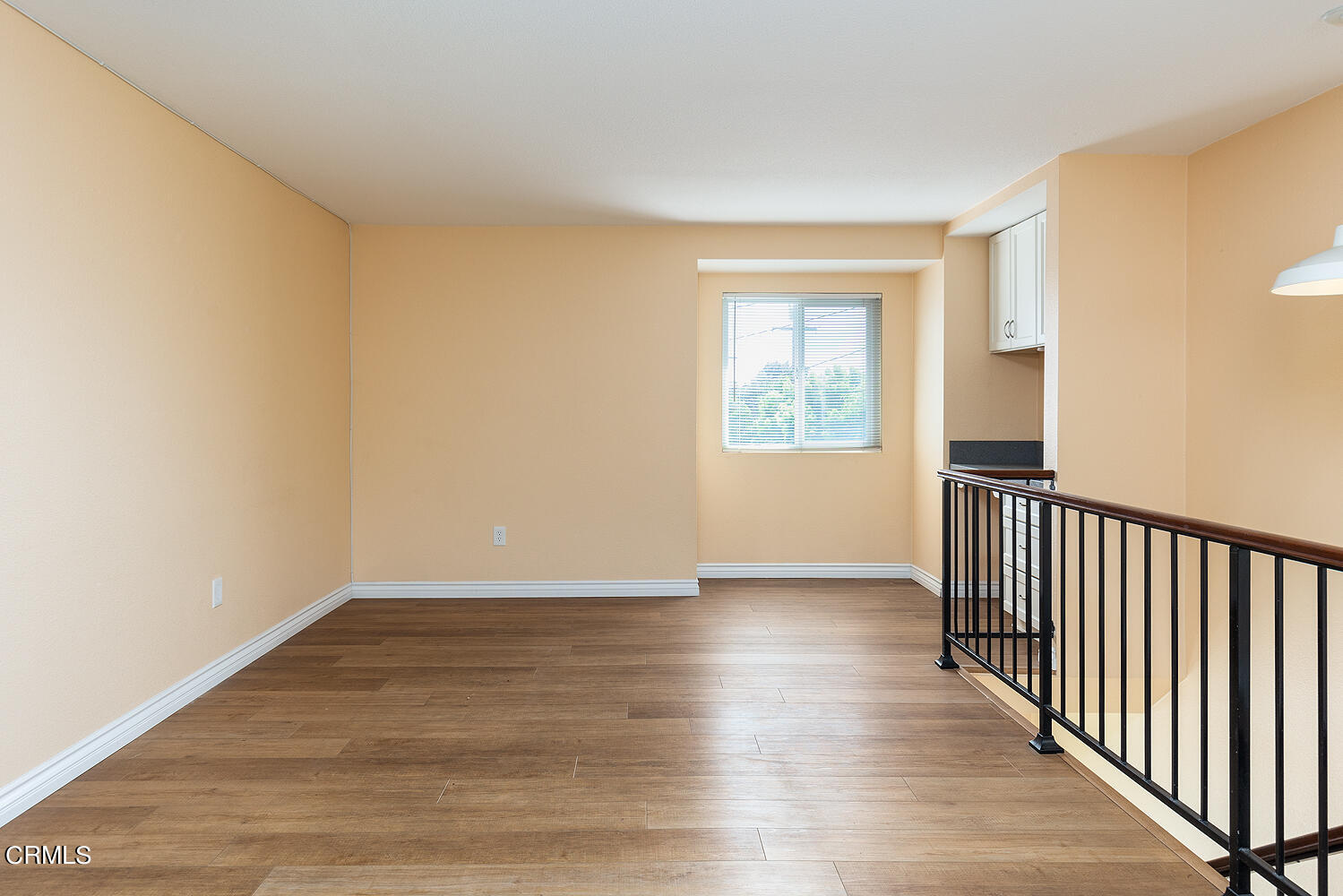 159-161 May Avenue Monrovia, CA 91016 - Photo 21 of 33 a view of an empty room with wooden floor and a window