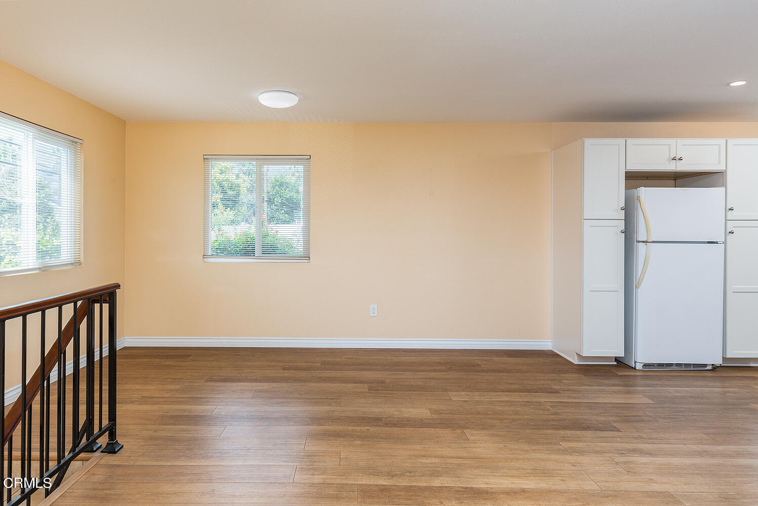 159-161 May Avenue Monrovia, CA 91016 - Photo 22 of 33 a view of an empty room with wooden floor and a window