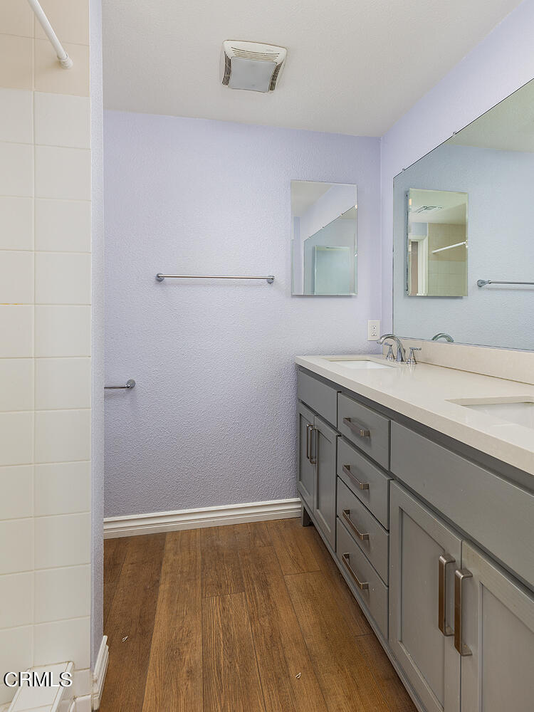 159-161 May Avenue Monrovia, CA 91016 - Photo 29 of 33 a bathroom with a sink and a mirror