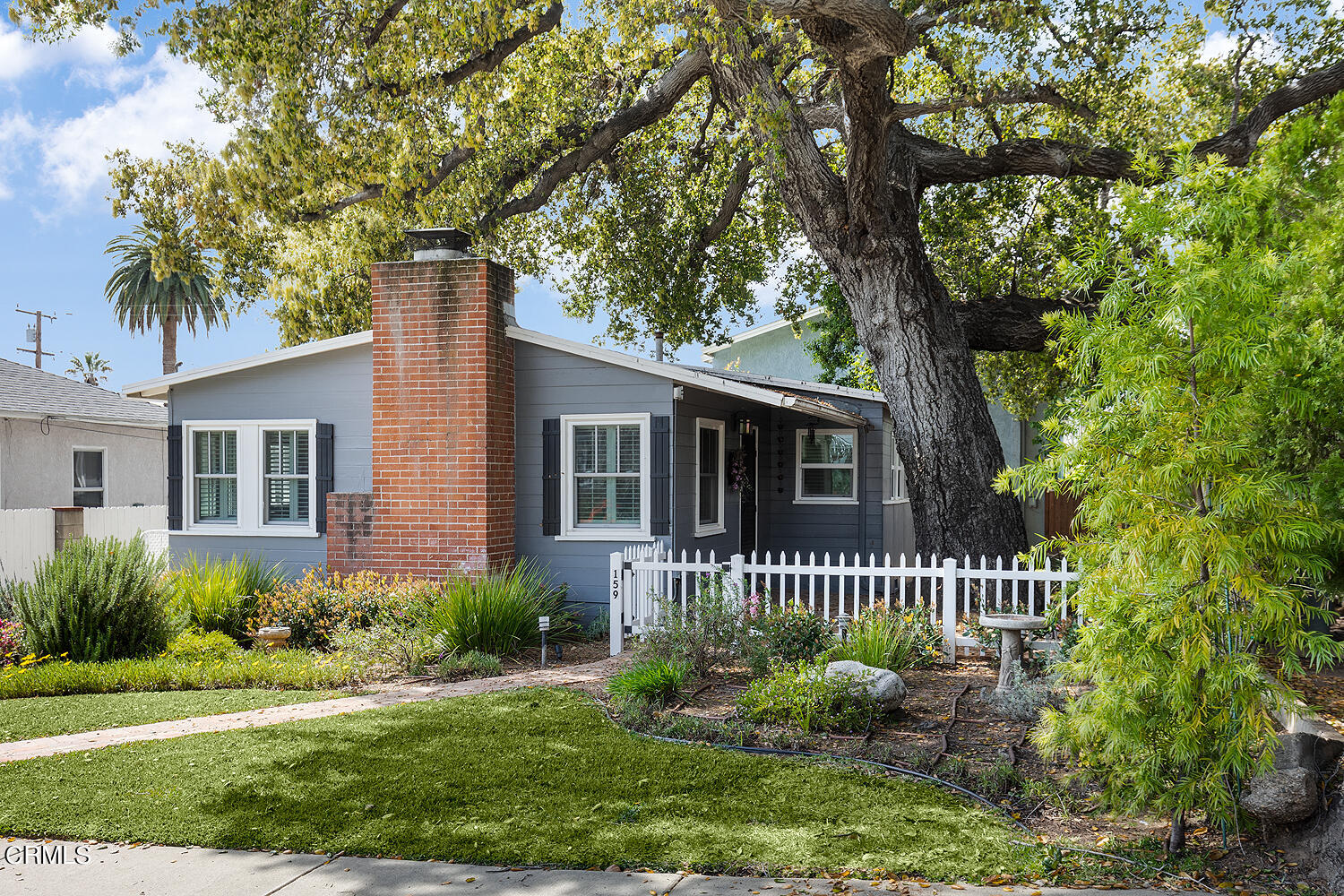 159-161 May Avenue Monrovia, CA 91016 - Photo 3 of 33 a front view of a house with a garden