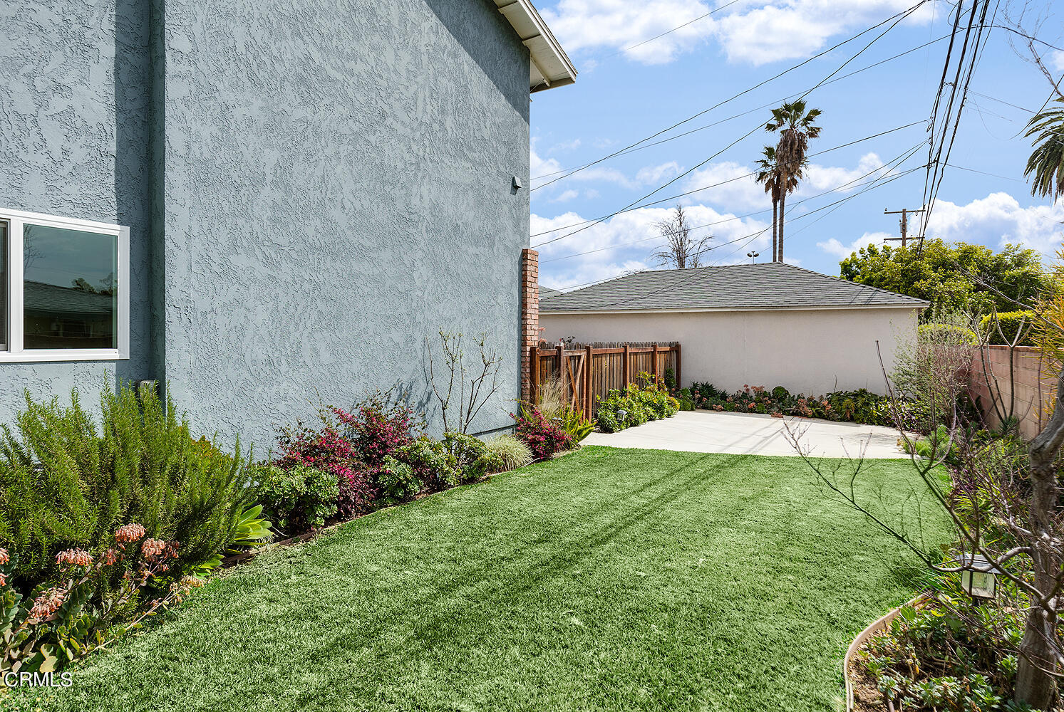 159-161 May Avenue Monrovia, CA 91016 - Photo 33 of 33 a view of a house with a yard and potted plants