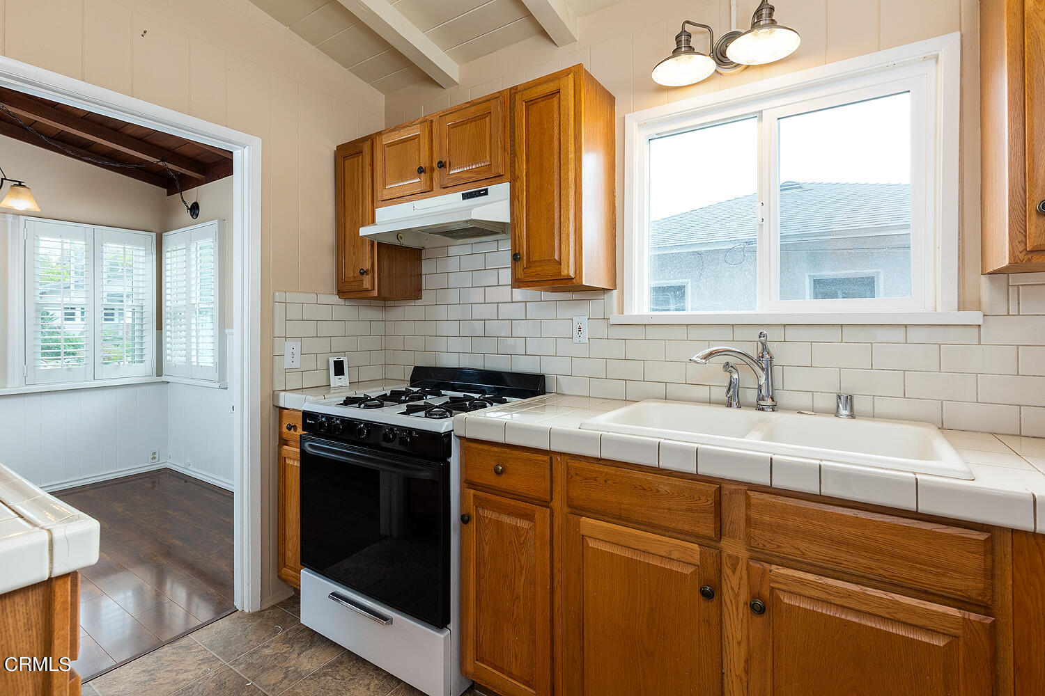 159-161 May Avenue Monrovia, CA 91016 - Photo 9 of 33 a kitchen with stainless steel appliances granite countertop a sink stove and refrigerator