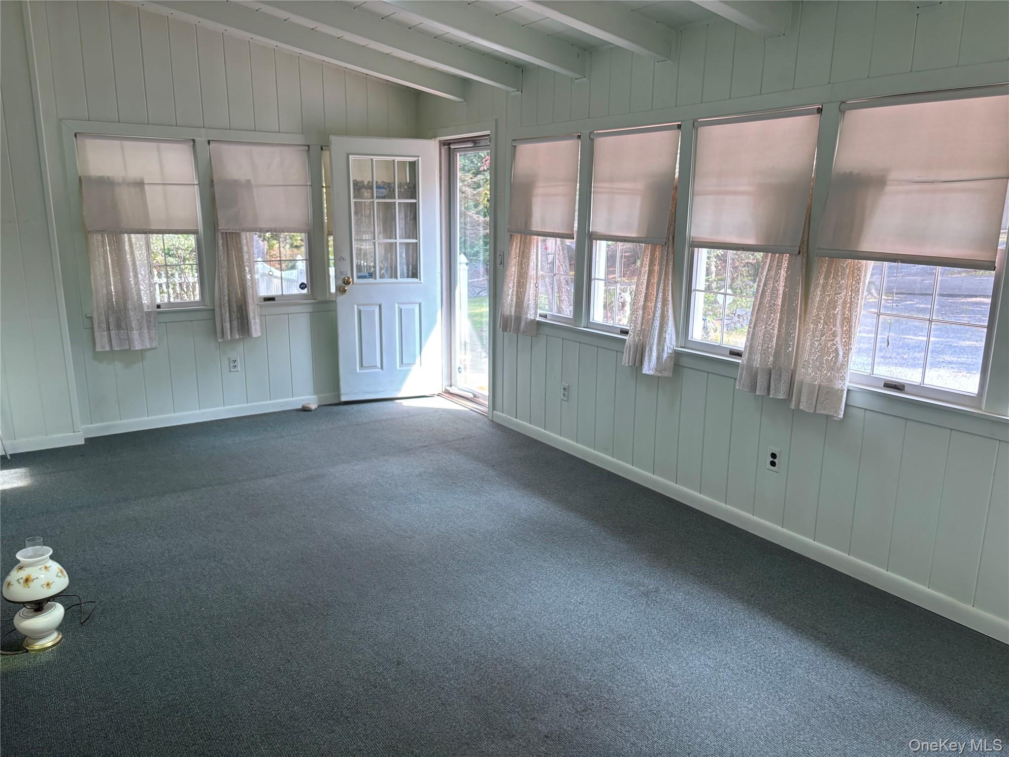 16 Rocklein Road Wading River, NY 11792 - Photo 19 of 21 Enclosed porch with heat/cac and skylights
