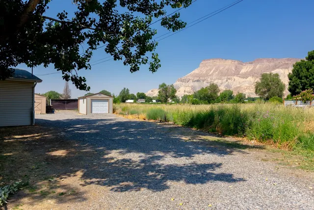 a view of a street with a yard