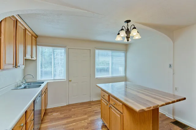 a room with wooden floor and window