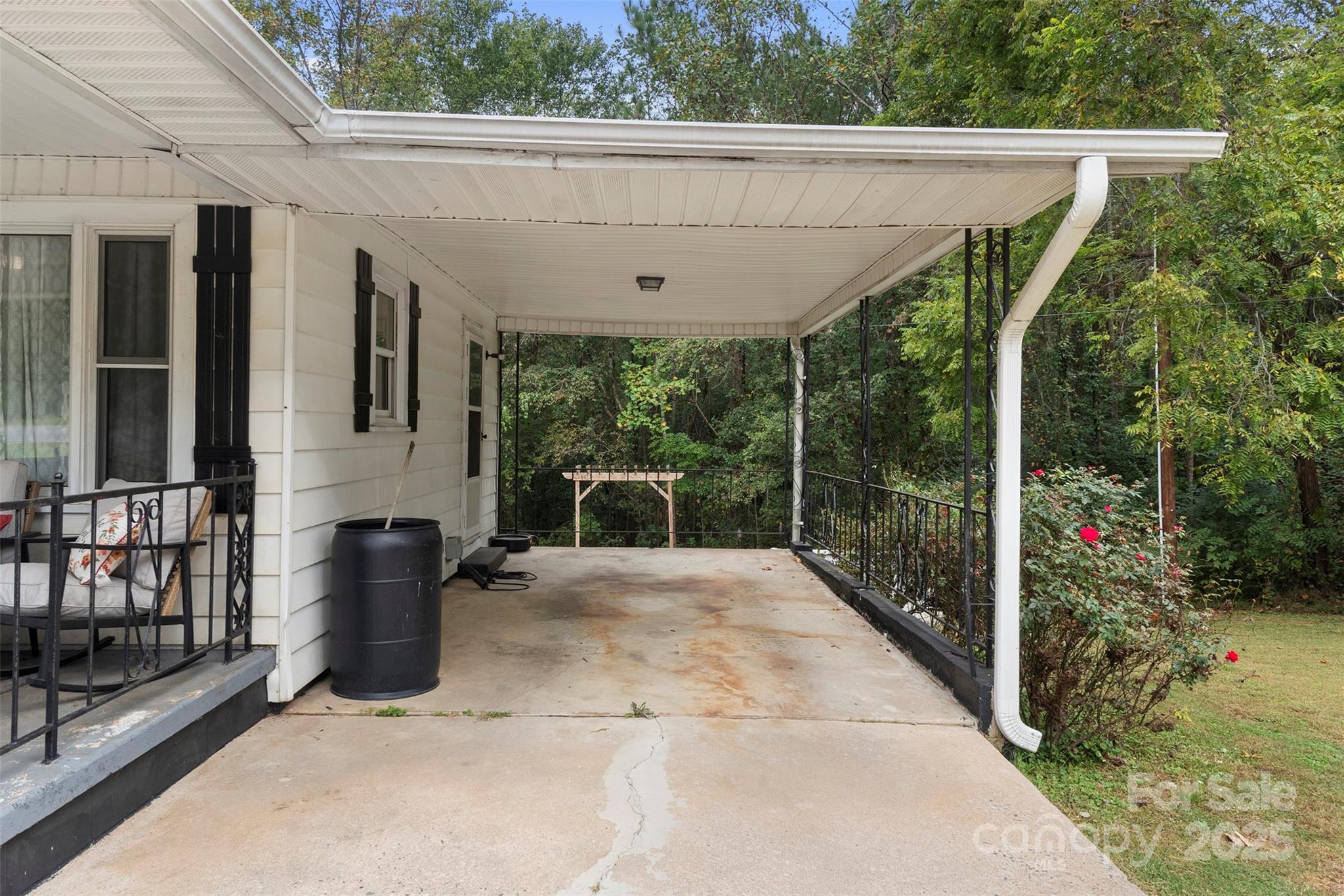 1238 Oak Grove Road Kings Mountain, NC 28086 - Photo 14 of 36 a view of a patio with table and chairs potted plants with wooden floor and fence