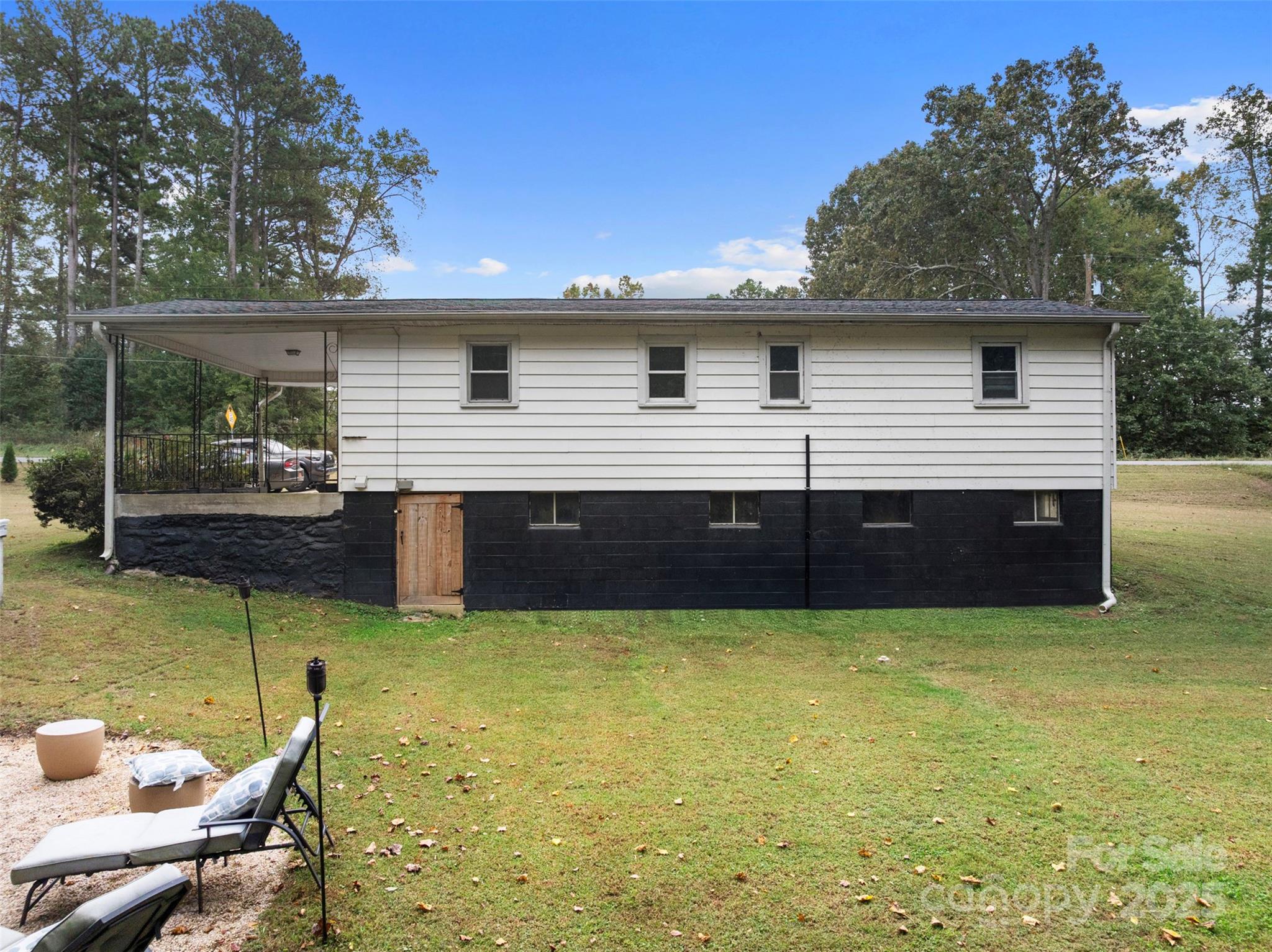 1238 Oak Grove Road Kings Mountain, NC 28086 - Photo 16 of 36 a view of a terrace with a table and chairs