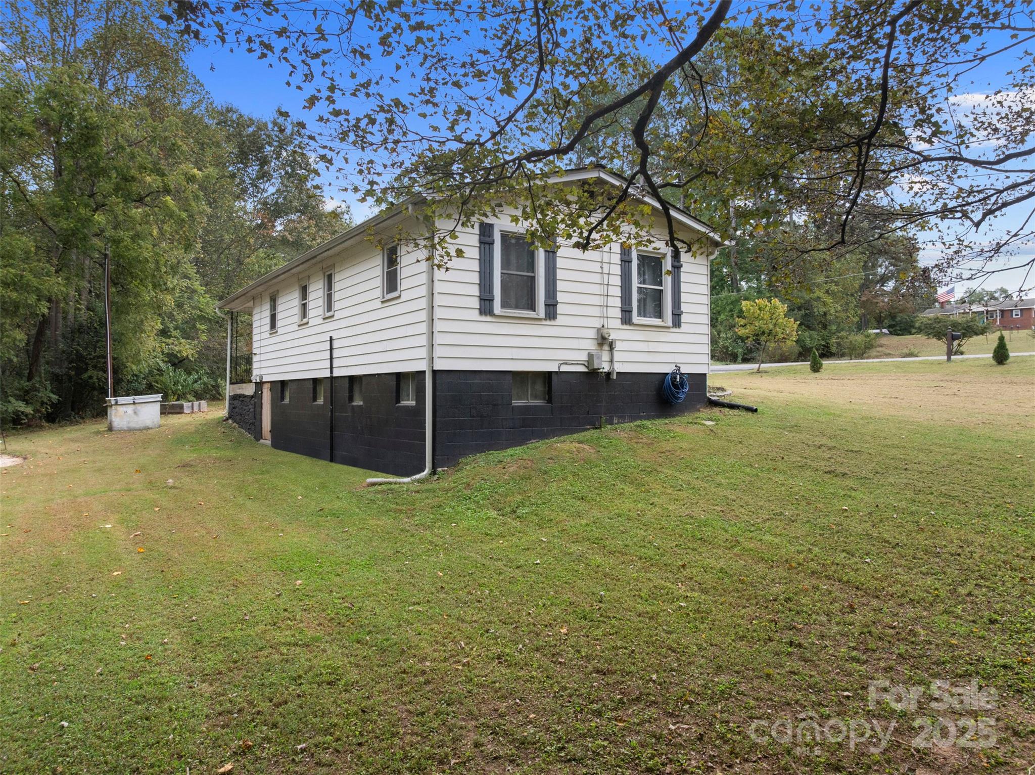1238 Oak Grove Road Kings Mountain, NC 28086 - Photo 18 of 36 a front view of a house with a yard and trees