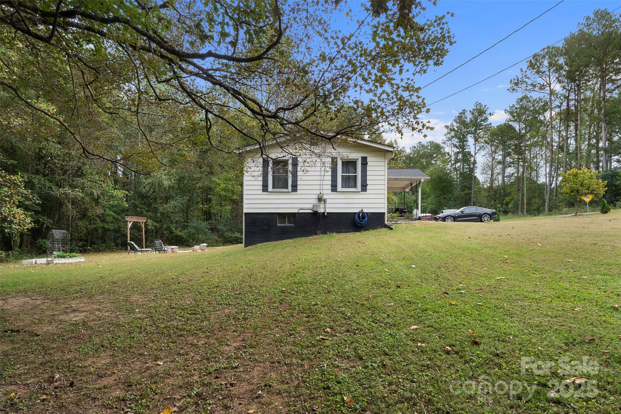 1238 Oak Grove Road Kings Mountain, NC 28086 - Photo 20 of 36 a house is sitting in middle of the forest