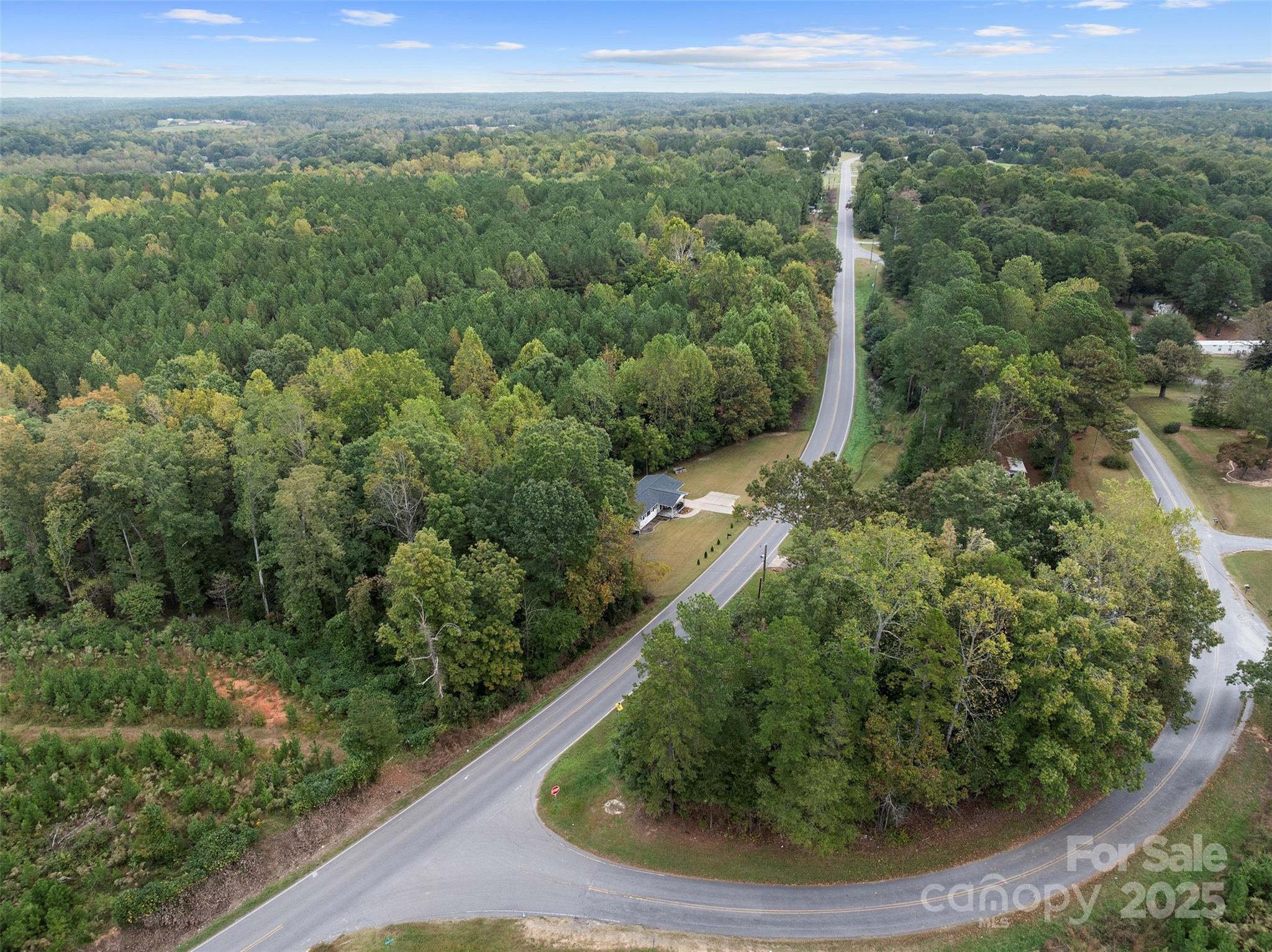 1238 Oak Grove Road Kings Mountain, NC 28086 - Photo 31 of 36 a view of a forest with a street