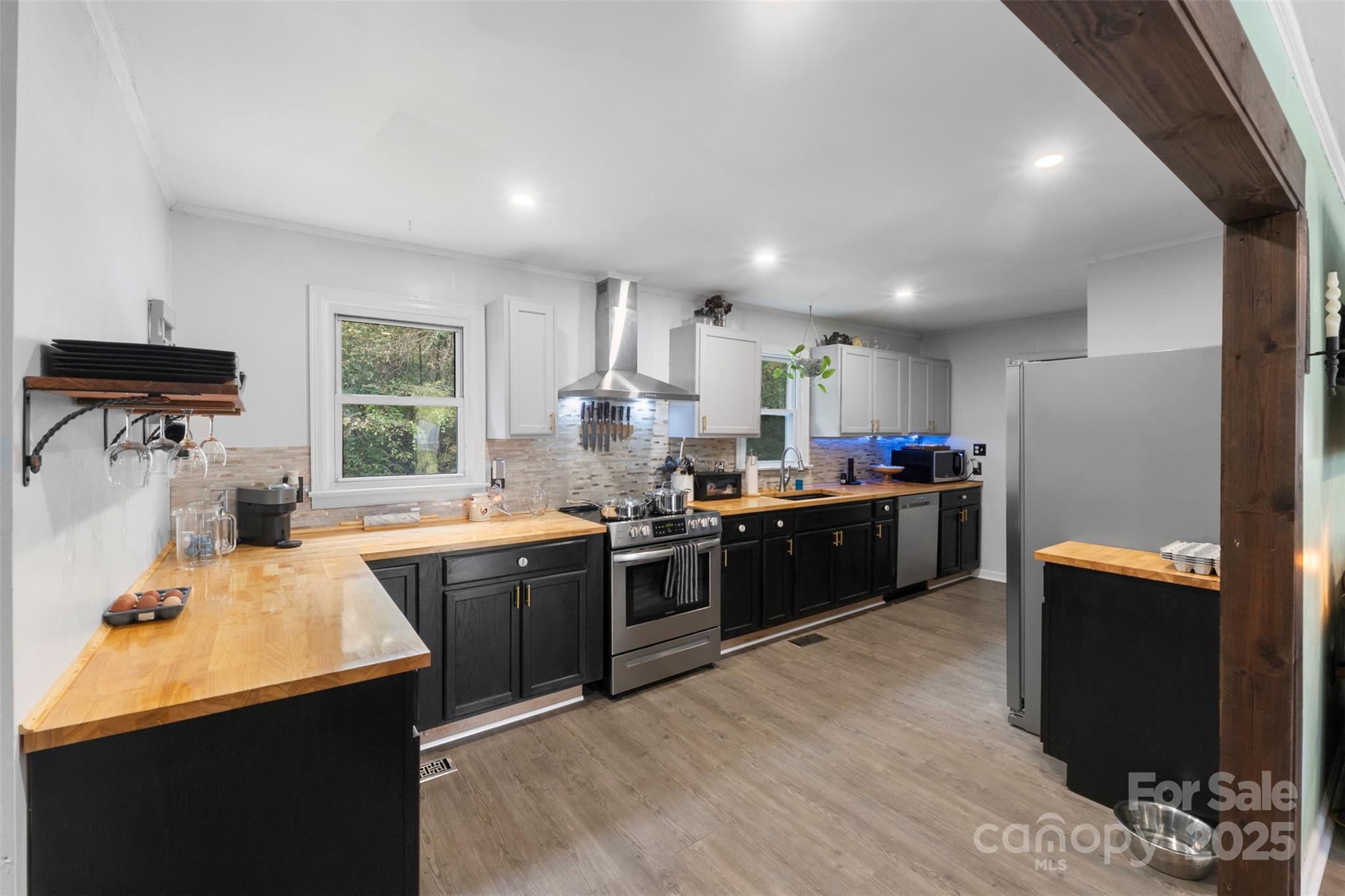 1238 Oak Grove Road Kings Mountain, NC 28086 - Photo 6 of 36 a large kitchen with a counter top space a sink stainless steel appliances and cabinets