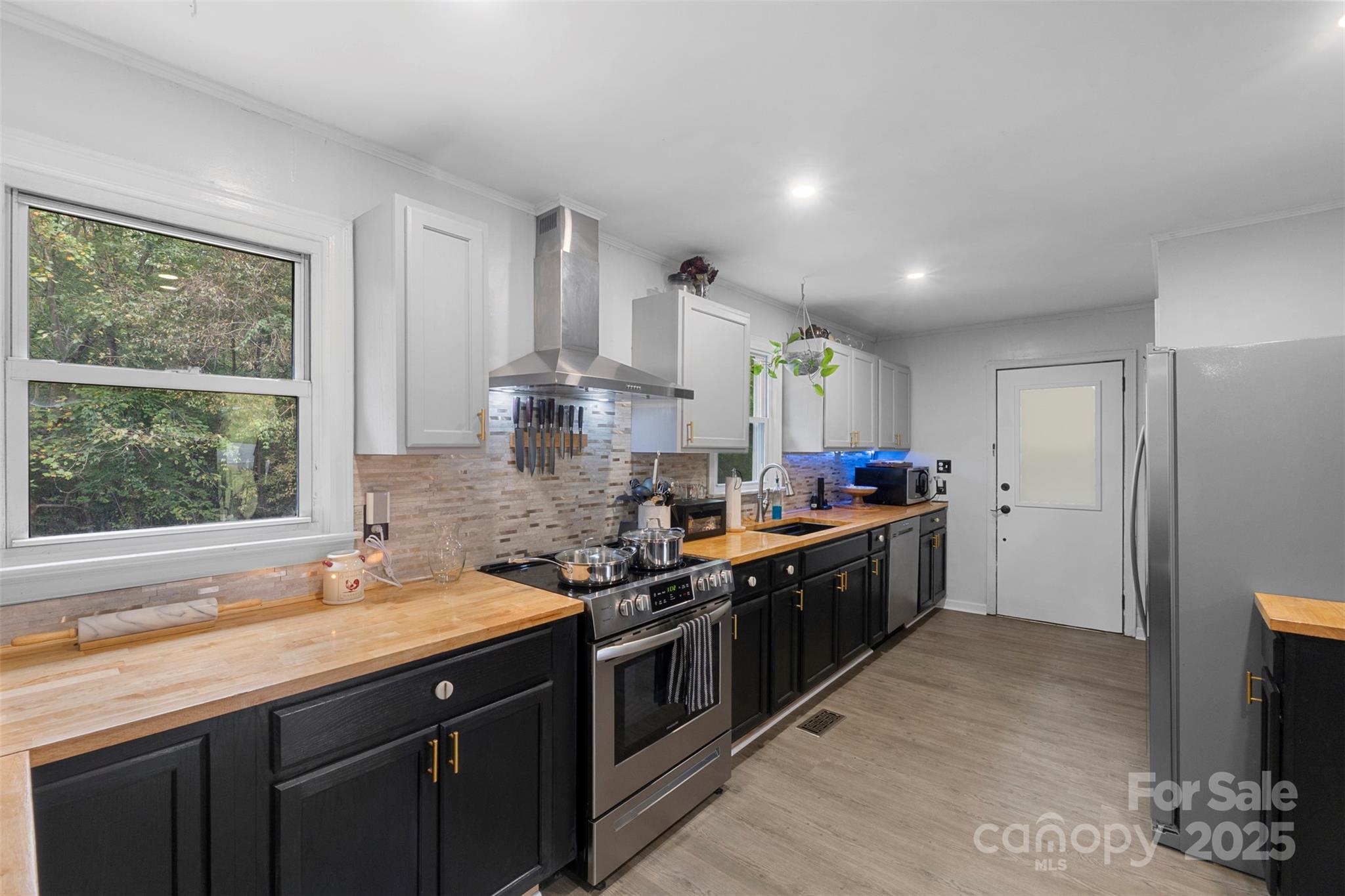 1238 Oak Grove Road Kings Mountain, NC 28086 - Photo 7 of 36 a kitchen with stainless steel appliances granite countertop a sink stove and refrigerator