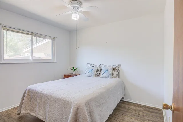 a bedroom with bed and window