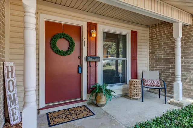 a view of a two chairs in the patio