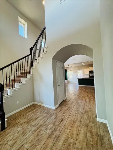 a view of kitchen with kitchen island and stainless steel appliances