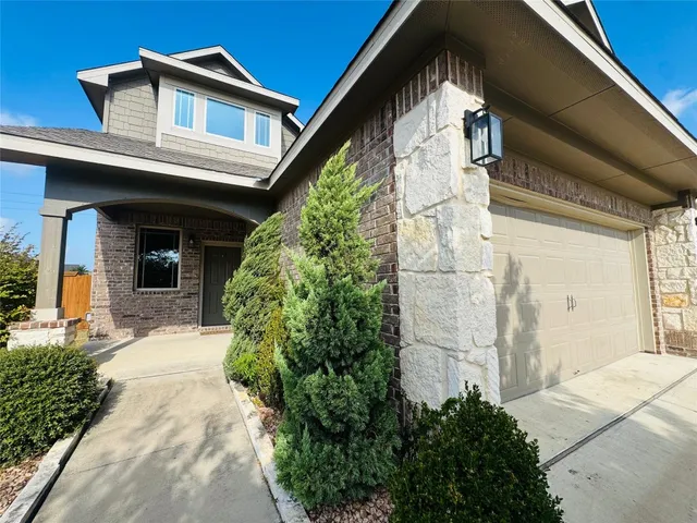 a view of a big room with chandelier fan and windows