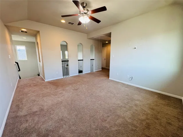 a view of a big room with carpet