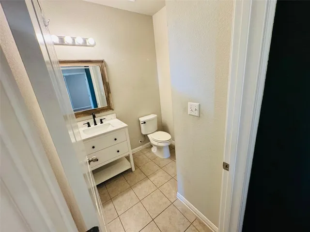 a bathroom with a toilet and a sink