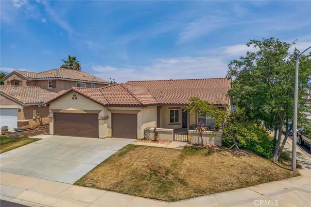 a view of a livingroom with wooden floor and a flat screen tv