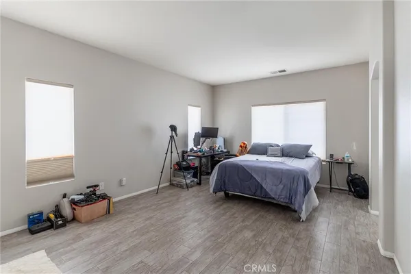 a large bathroom with a sink a large mirror and a bathtub