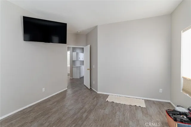 a bathroom with a tub double vanity sink and mirror