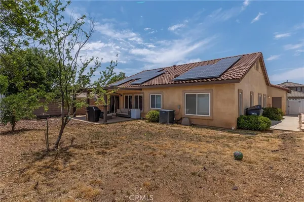 a view of a backyard of the house