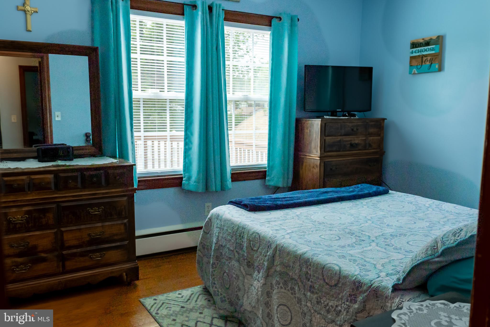 106 Centerton Road Bridgeton, NJ 08302 - Photo 16 of 31 a bedroom with a bed and a flat screen tv