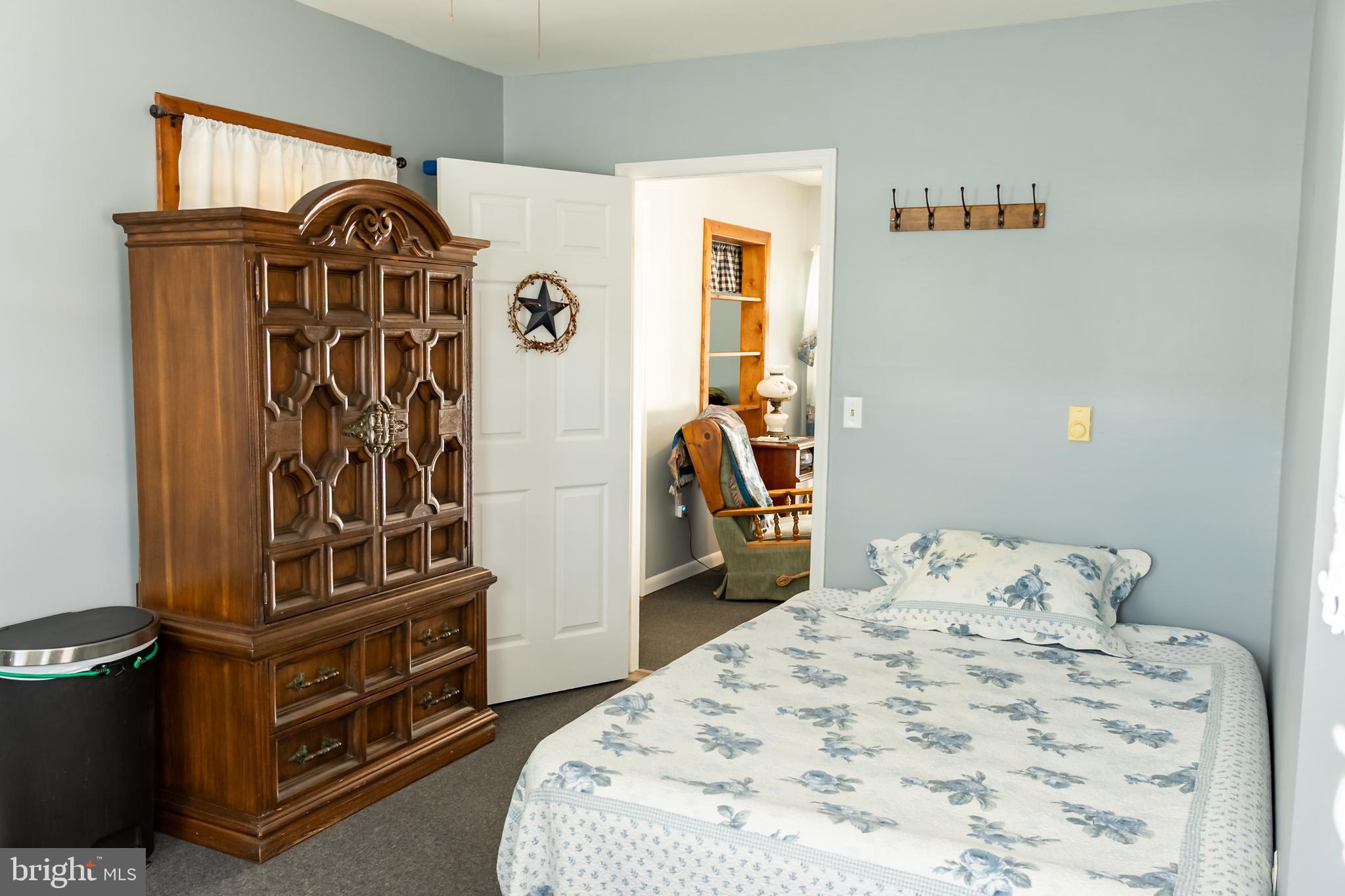 106 Centerton Road Bridgeton, NJ 08302 - Photo 17 of 31 a bedroom with a bed and a mirror