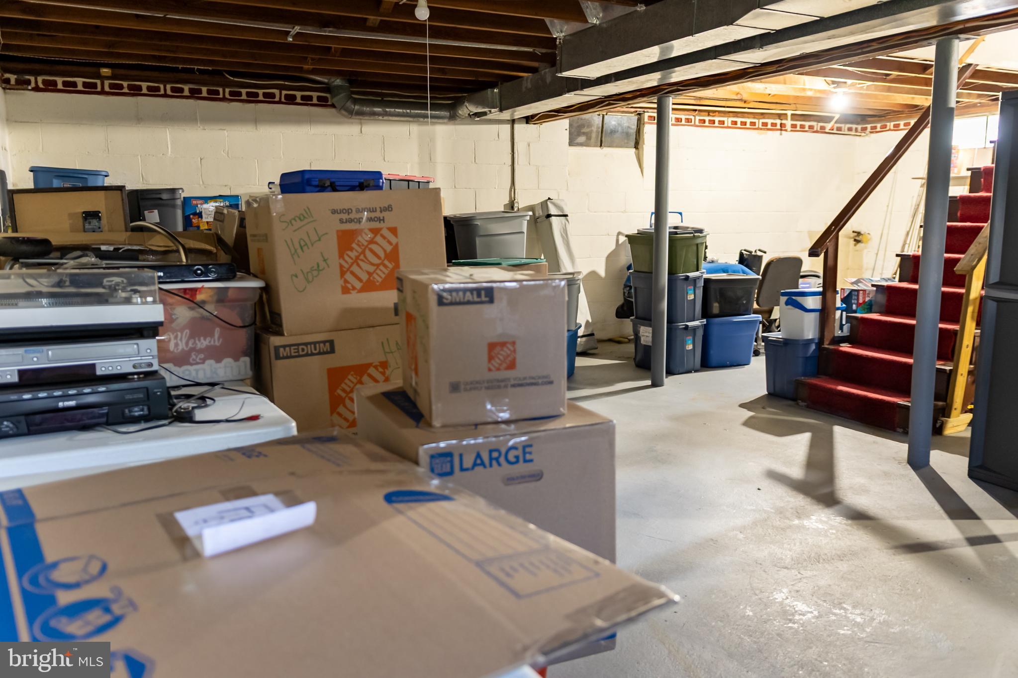 106 Centerton Road Bridgeton, NJ 08302 - Photo 31 of 31 a storage room with water heater and racks