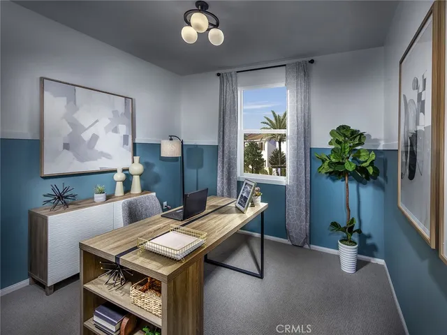 a living room with lots of furniture and a flat screen tv