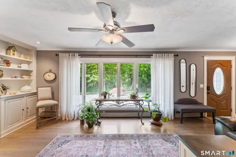 a living room with furniture and a large window