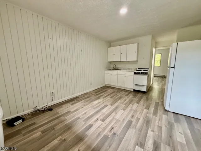 a view of a kitchen with electric appliances