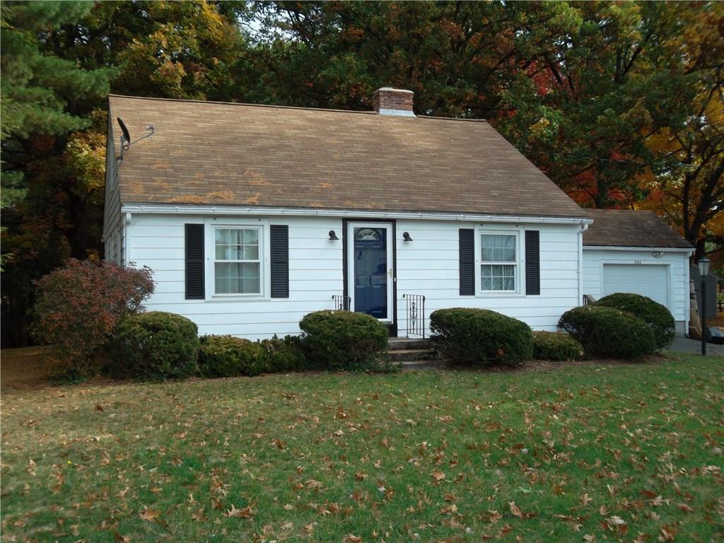 a view of a house with a garden and plants