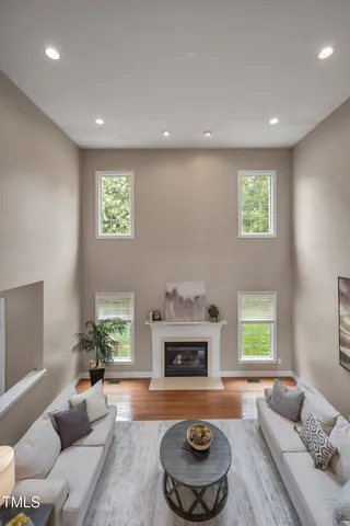 a kitchen with kitchen island granite countertop wooden cabinets stainless steel appliances a window and a counter space