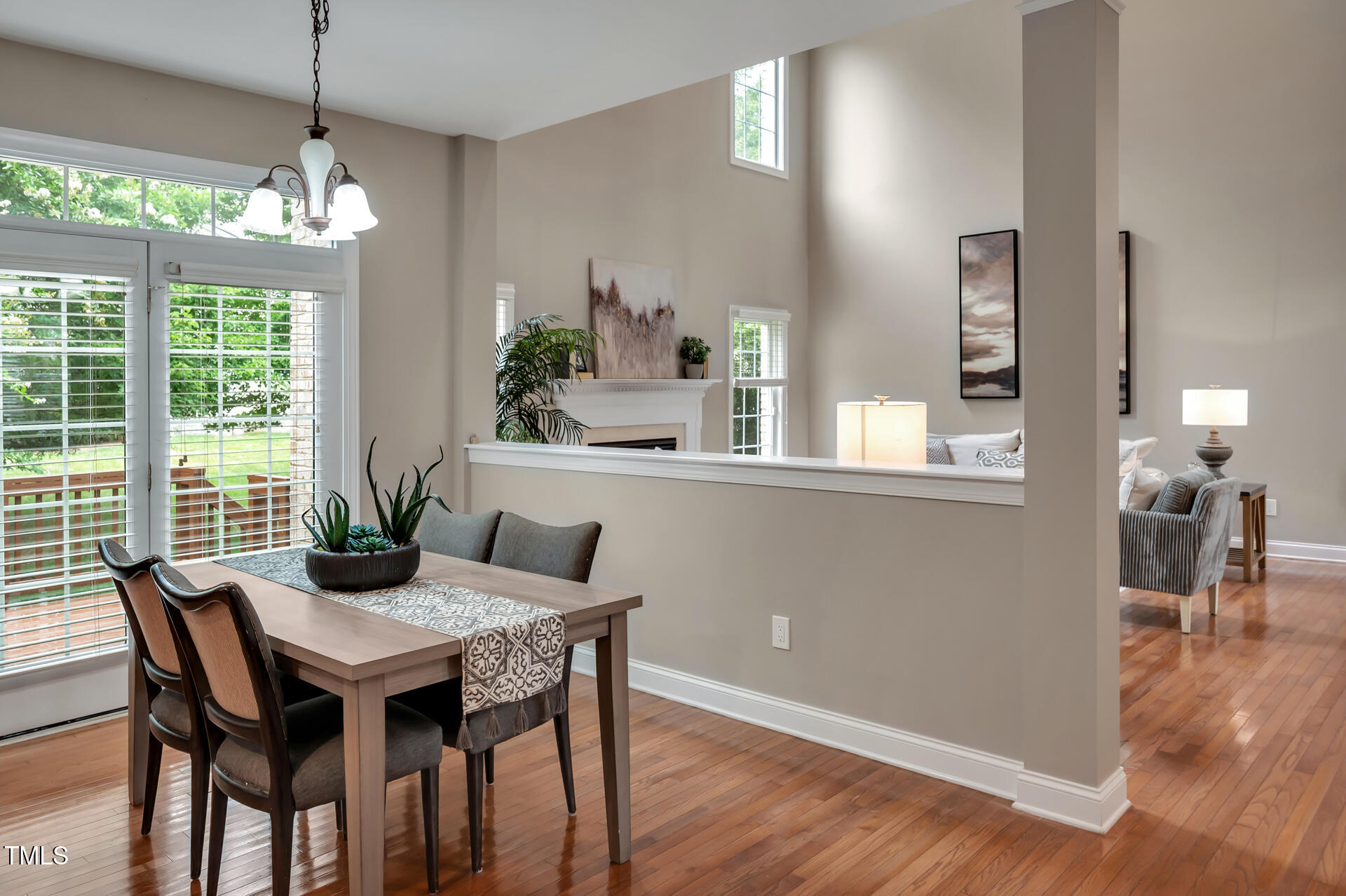 9628 Club Valley Way Raleigh, NC 27617 - Photo 18 of 68 a view of a dining room with furniture window and wooden floor
