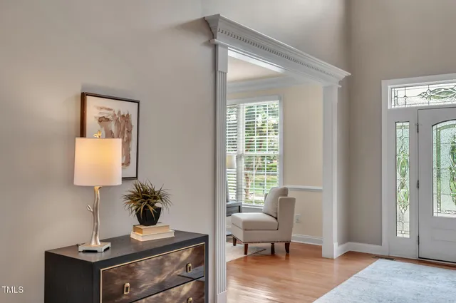 a living room with furniture and large window