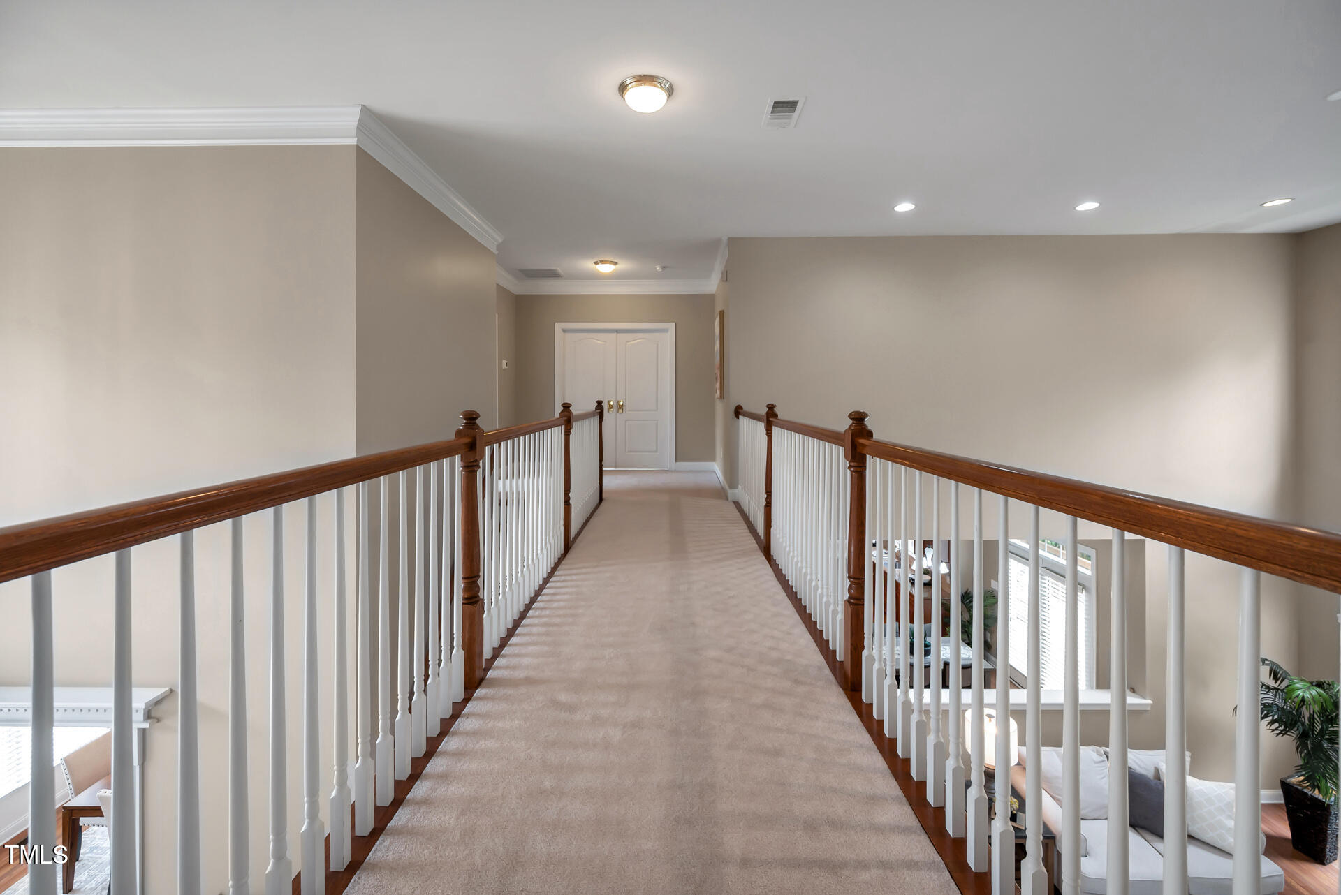 9628 Club Valley Way Raleigh, NC 27617 - Photo 39 of 68 a view of a hallway with wooden floor