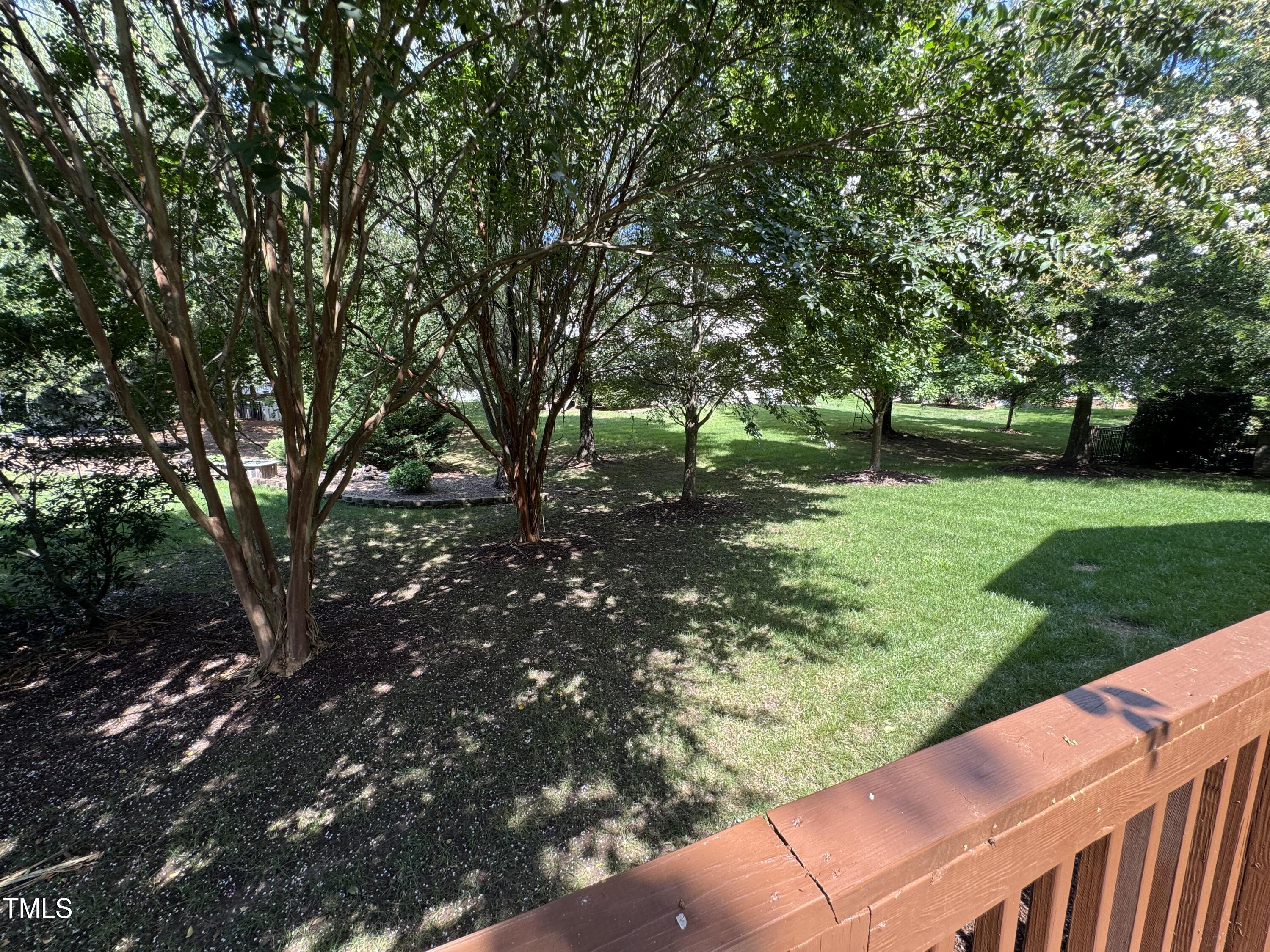 9628 Club Valley Way Raleigh, NC 27617 - Photo 55 of 68 a view of a backyard with large trees
