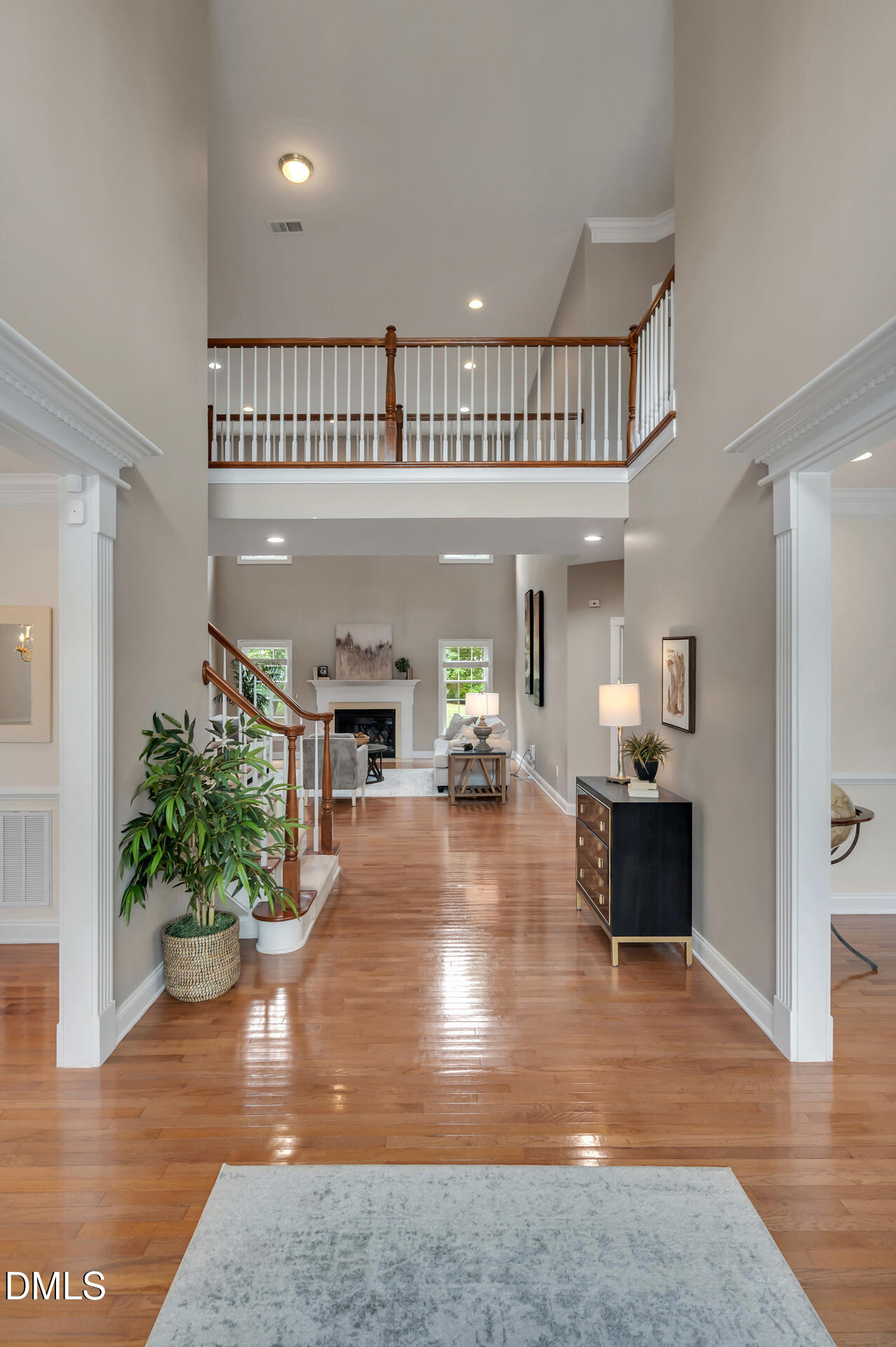 9628 Club Valley Way Raleigh, NC 27617 - Photo 5 of 68 a living room with furniture and a chandelier