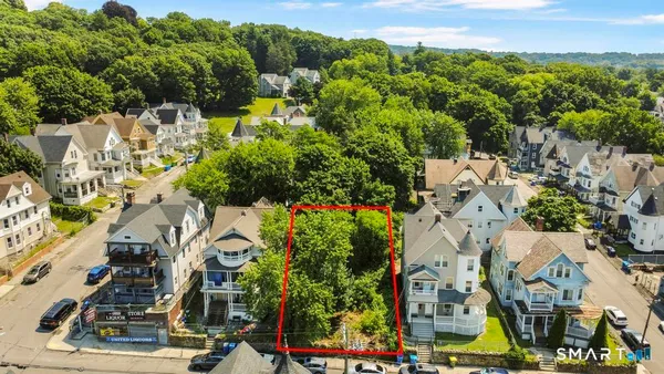 a view of multiple houses with yard