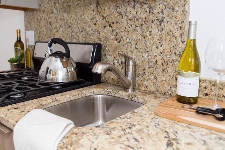 16 5th Street, Unit 8 Chelsea, MA 02150 - Photo 3 of 15 a close view of a sink and a table