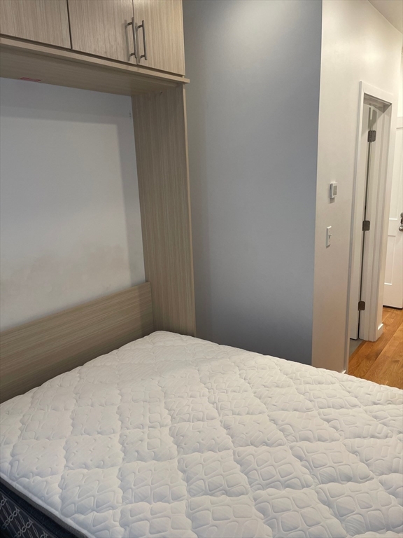 16 5th Street, Unit 8 Chelsea, MA 02150 - Photo 7 of 15 a bedroom with a bed and a window