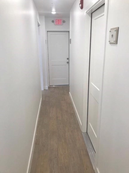 16 5th Street, Unit 8 Chelsea, MA 02150 - Photo 10 of 15 a view of a hallway with wooden floor