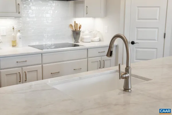 a bathroom with a sink and vanity