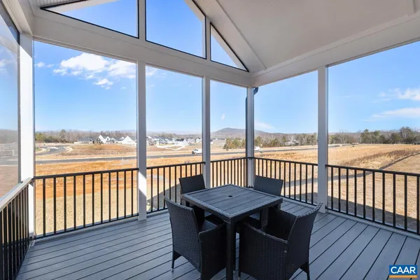 a view of a balcony with wooden floor
