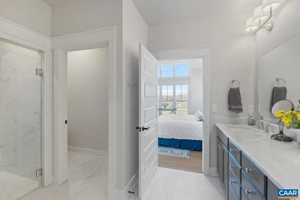 a bathroom with a tub sink and mirror